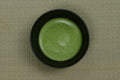 Prepared matcha in a bowl, illustrative serving concept
